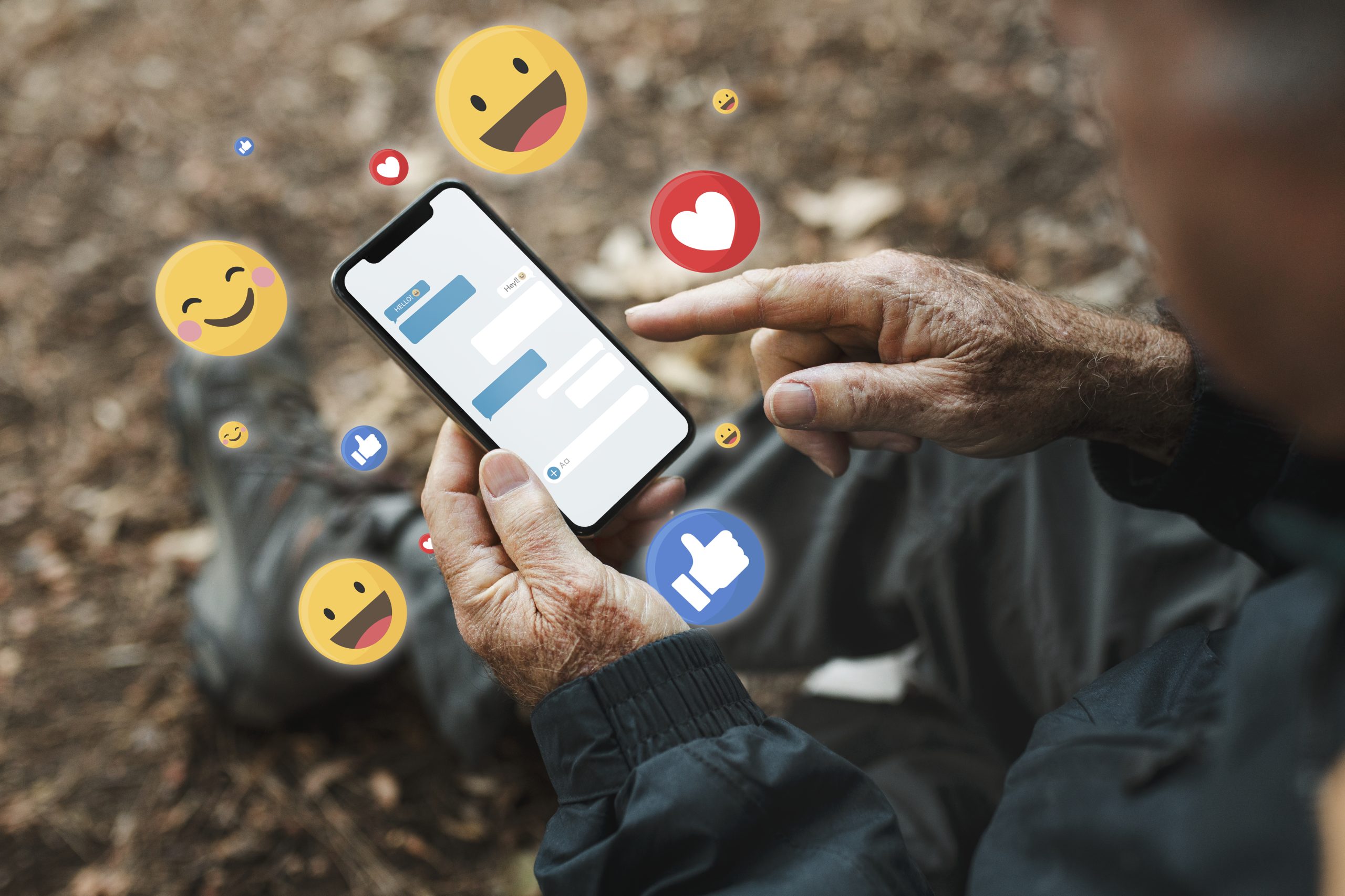 senior man receiving positive reactions from social media